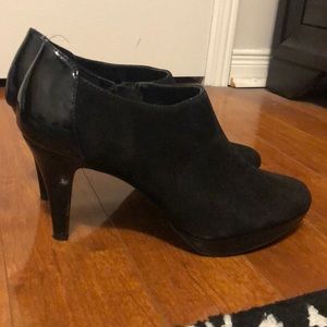 Black suede heels with shine on the back